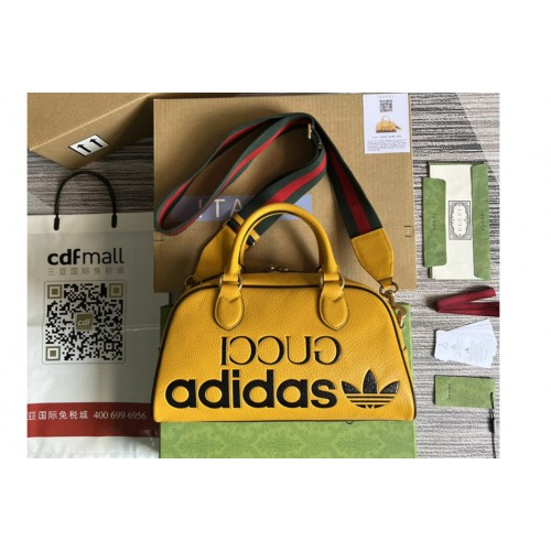 adidas x Gucci mini duffle bag in Orange and Black leather